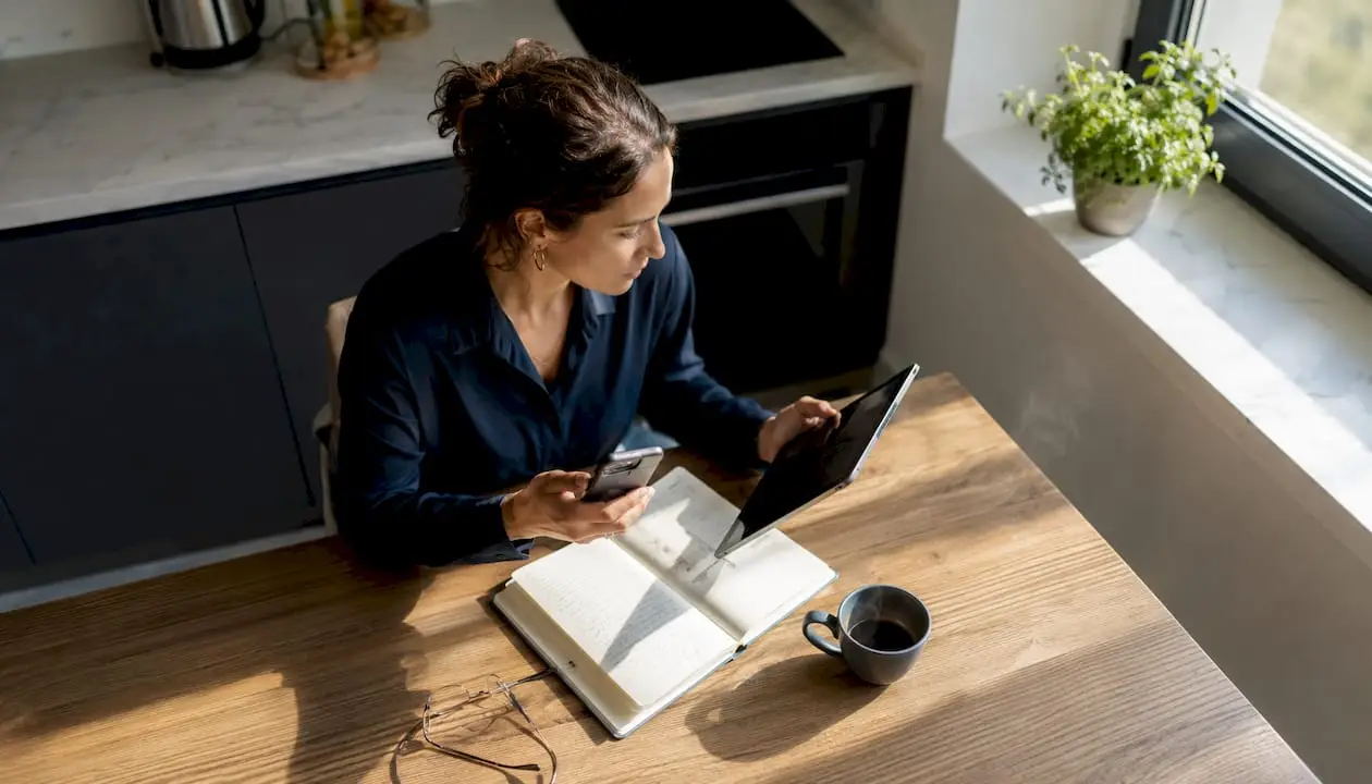 Woman comparing vacation rental platforms at home