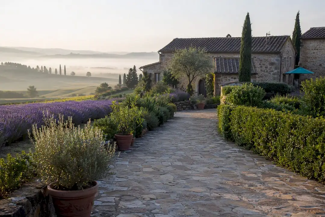 Tuscan villa at sunrise with hills