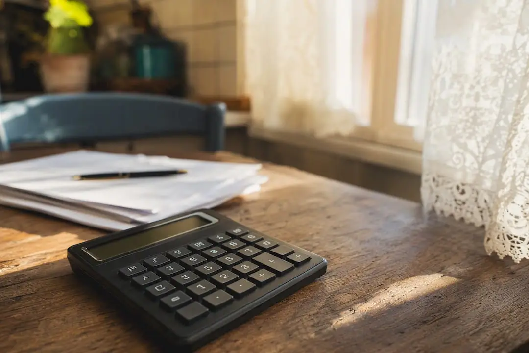 Calculator and mortgage documents in Italian setting